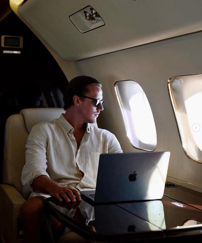 Dovy, trader and mentor, working from a laptop